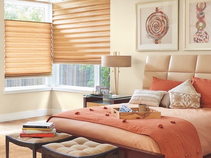 A bedroom with copper tray and copper-colored bedding.